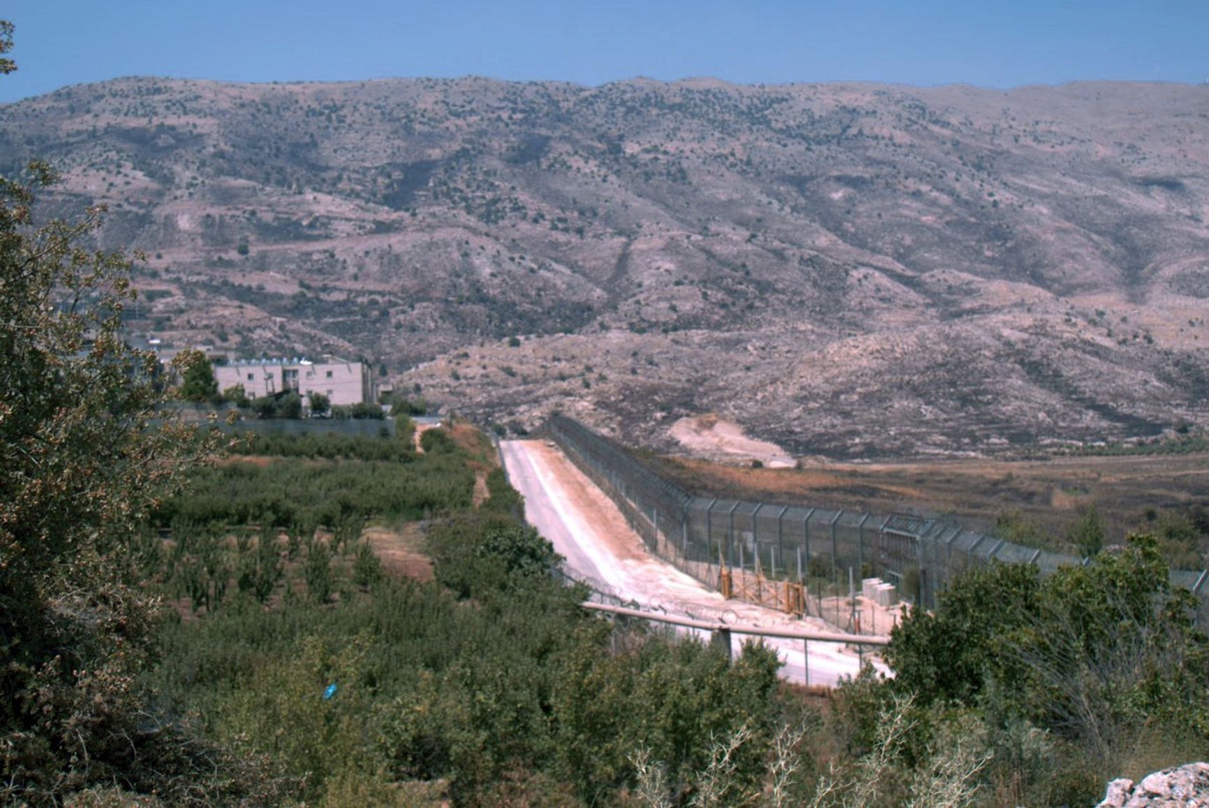 The barbed-wire fence separating the Israeli Druze village of Majdal Shams from Syrian territory divides families